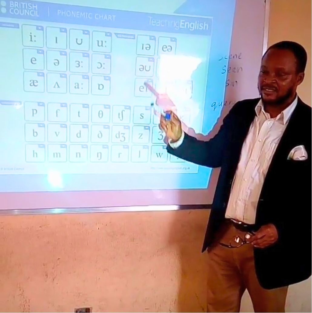 Teacher Uchechukwu, from Nigeria, using the Phonemic Chart to teach English pronunciation.