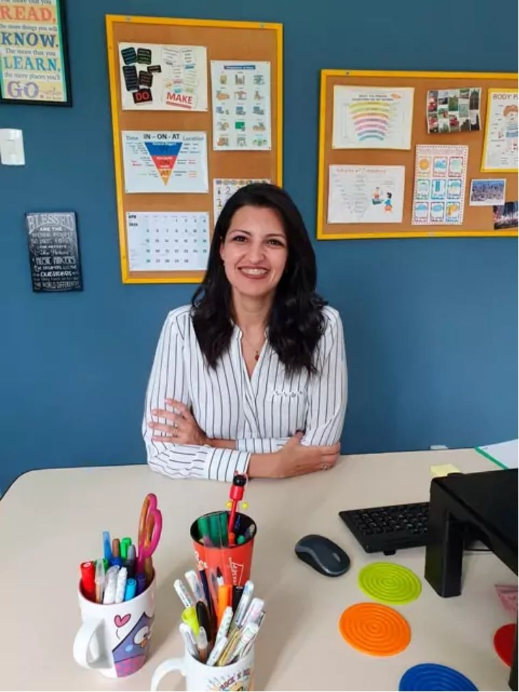 Teacher Carla, from Brazil, in her home-based classroom that she uses to teach in person and online.