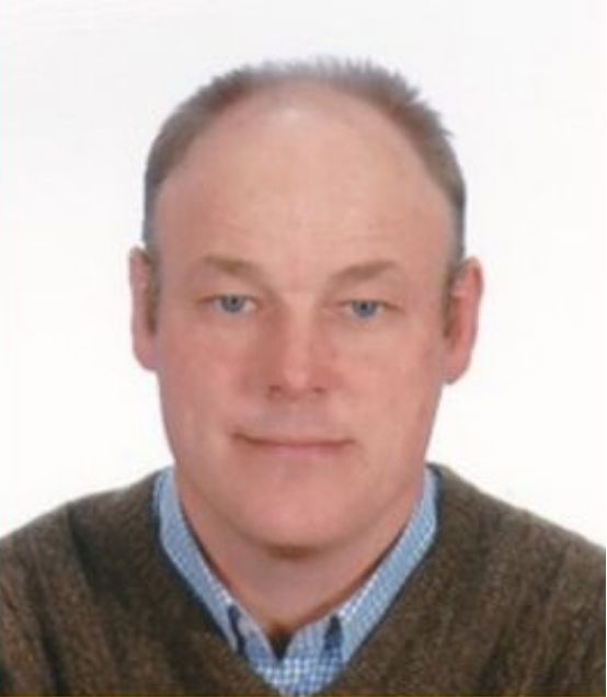 A headshot of Bridge grad and English teacher Edward.