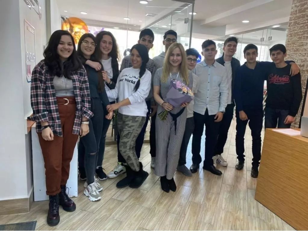 IELTS teacher Nasim, from Iran, with her students