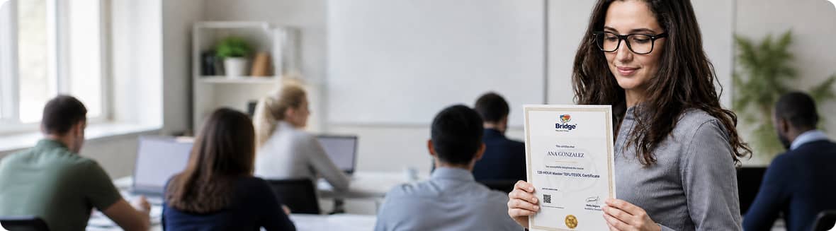 Bridge graduate holding a certificate in class