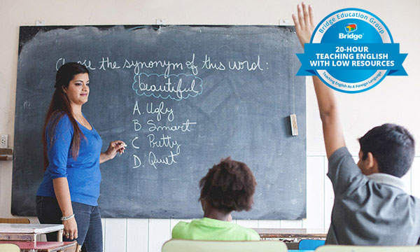 Teacher at a chalkboard with Bridge 20-hour Teaching English with Low Resources certification badge