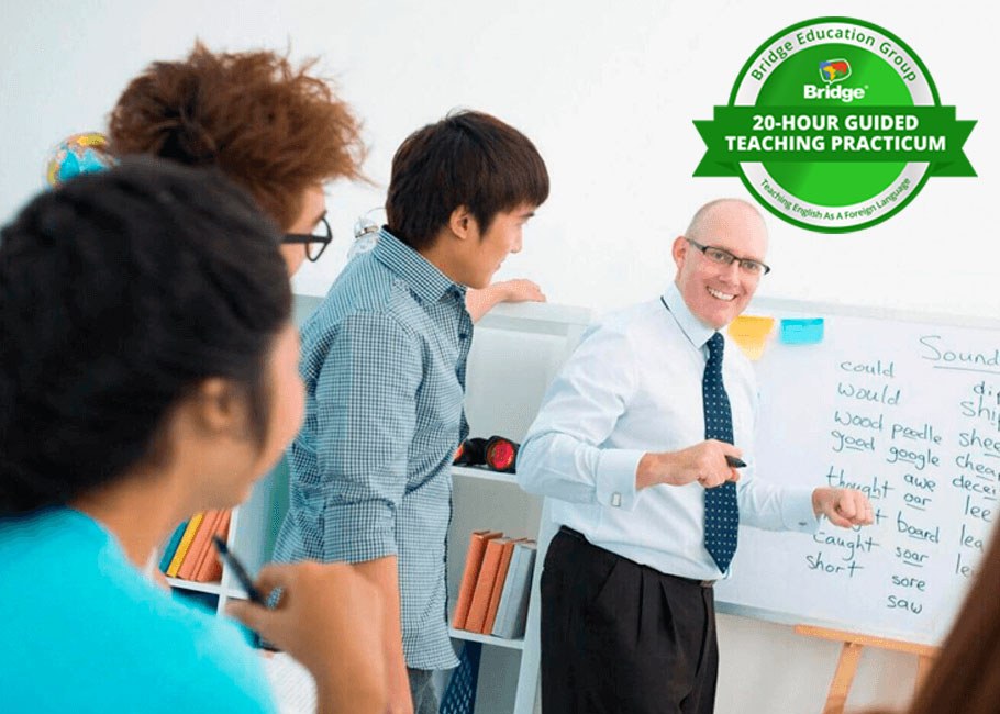 Teacher leading a classroom lesson with Bridge 20-hour Guided Teaching Practicum certification badge