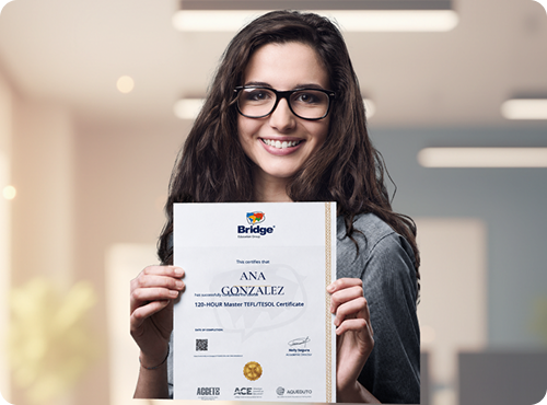 Teacher holding a Bridge TEFL certificate