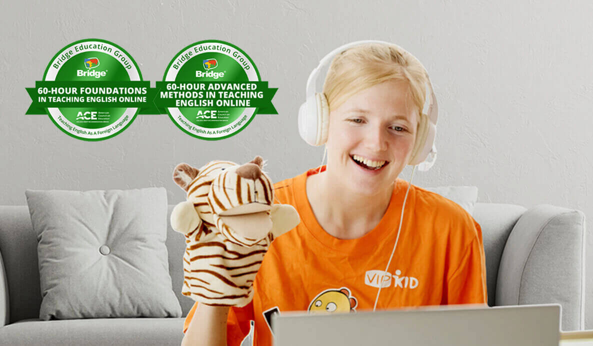 Teacher preparing to teach English online with headphones and classroom props