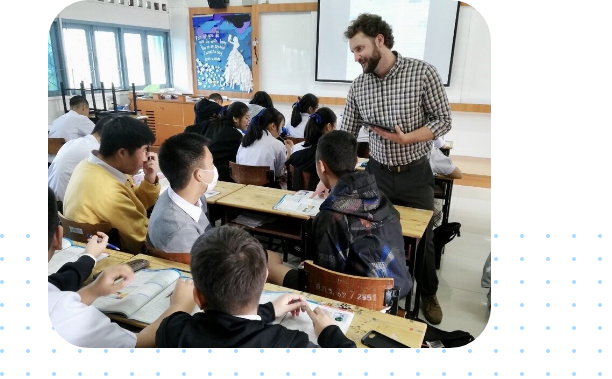 Teacher in classroom working with students